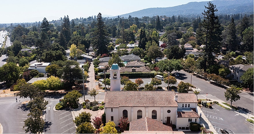 Aerial view of suburban neighborhood with church.
