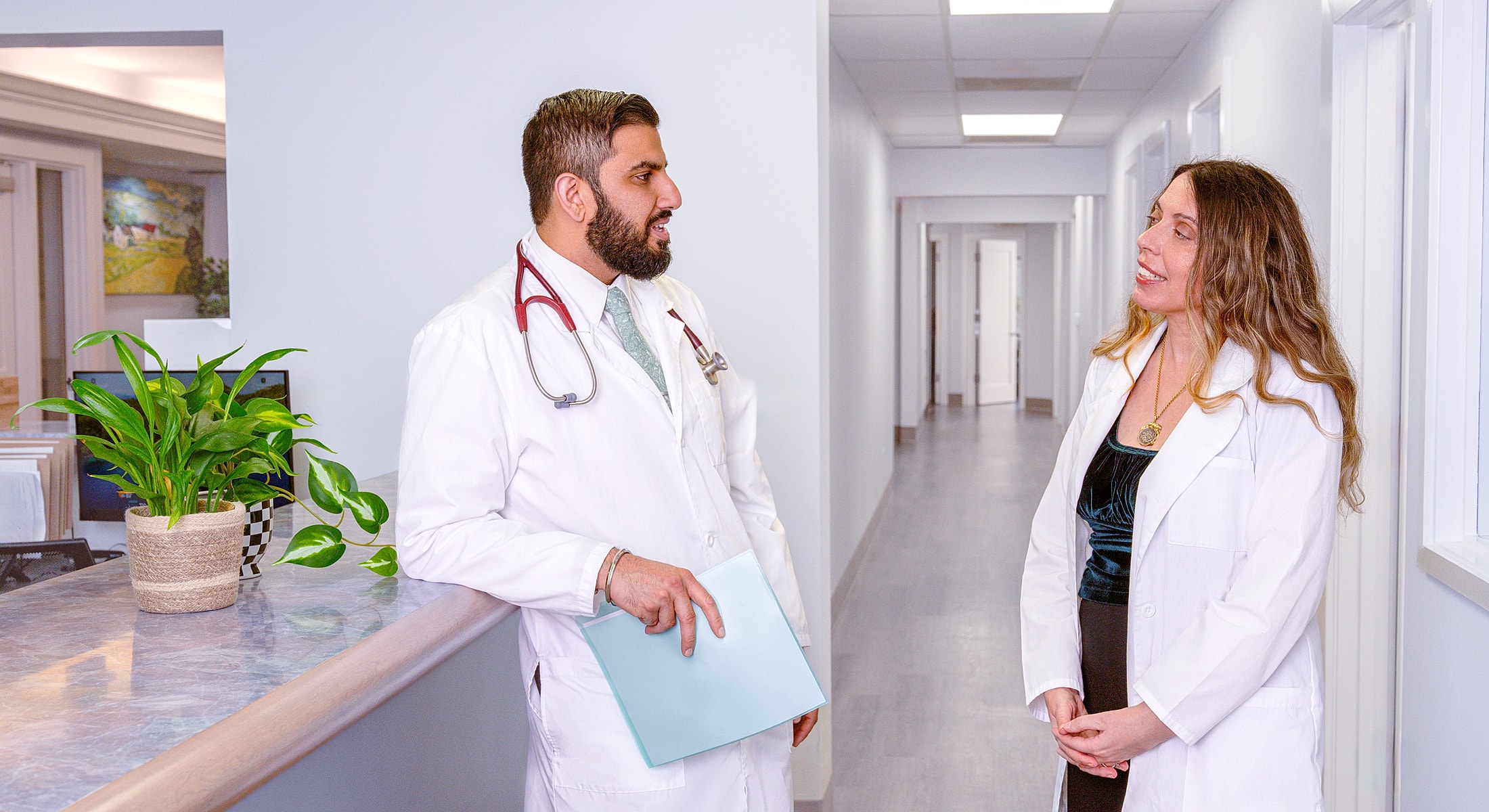 Doctors conversing in a modern clinic setting.